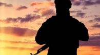 concept-terrorism-silhouette-terrorist-with-weapon-against-background-sunset_556258-1920