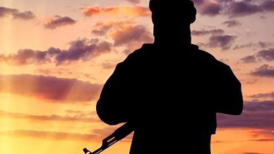 concept-terrorism-silhouette-terrorist-with-weapon-against-background-sunset_556258-1920