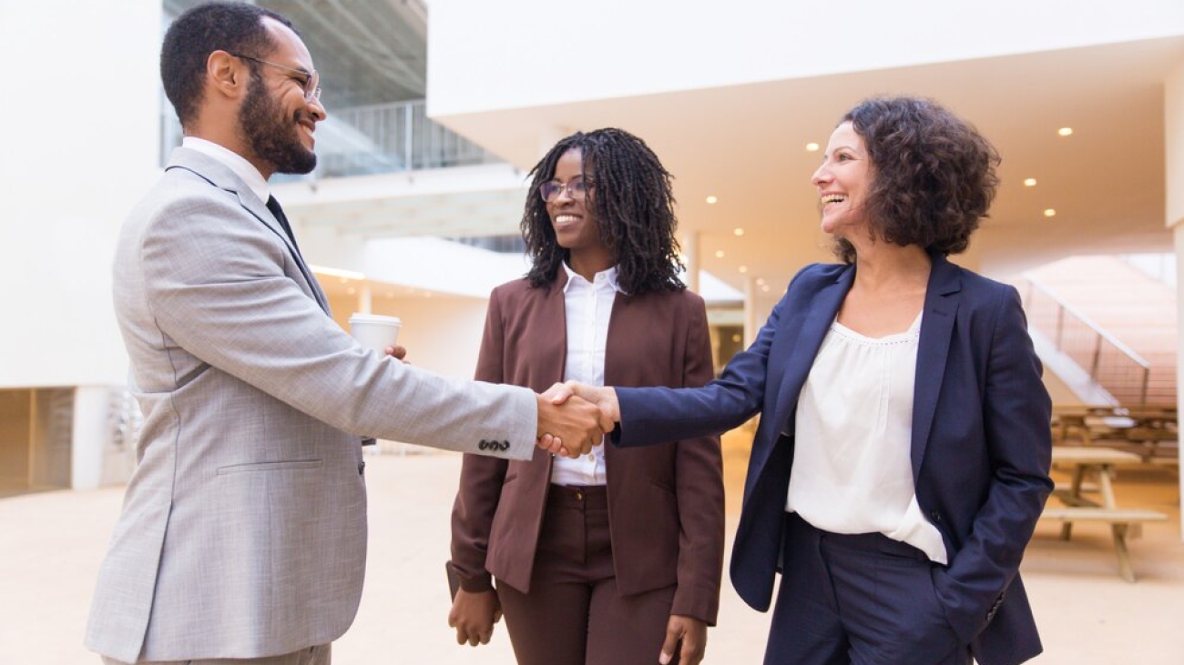 happy-positive-business-partners-finishing-meeting_74855-2918